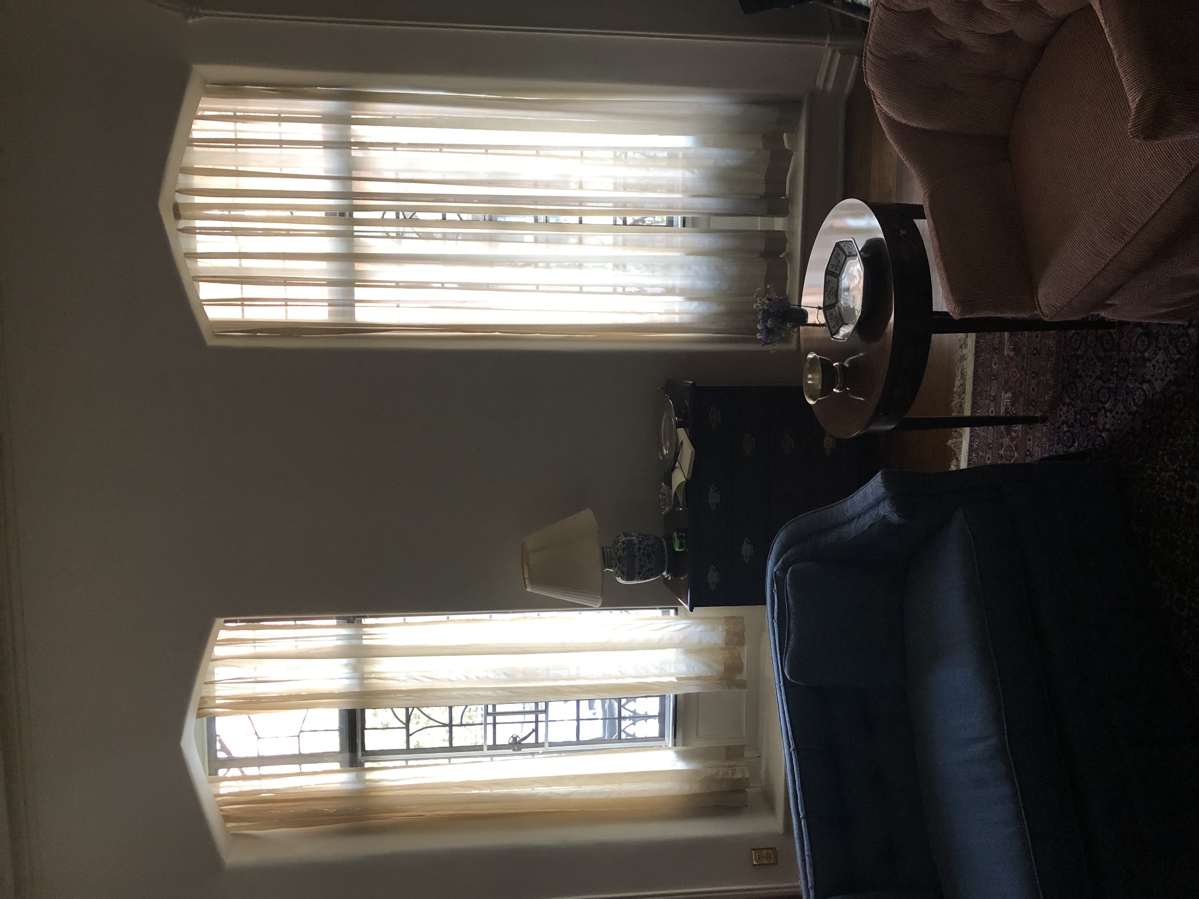 Roman shades installed in living room