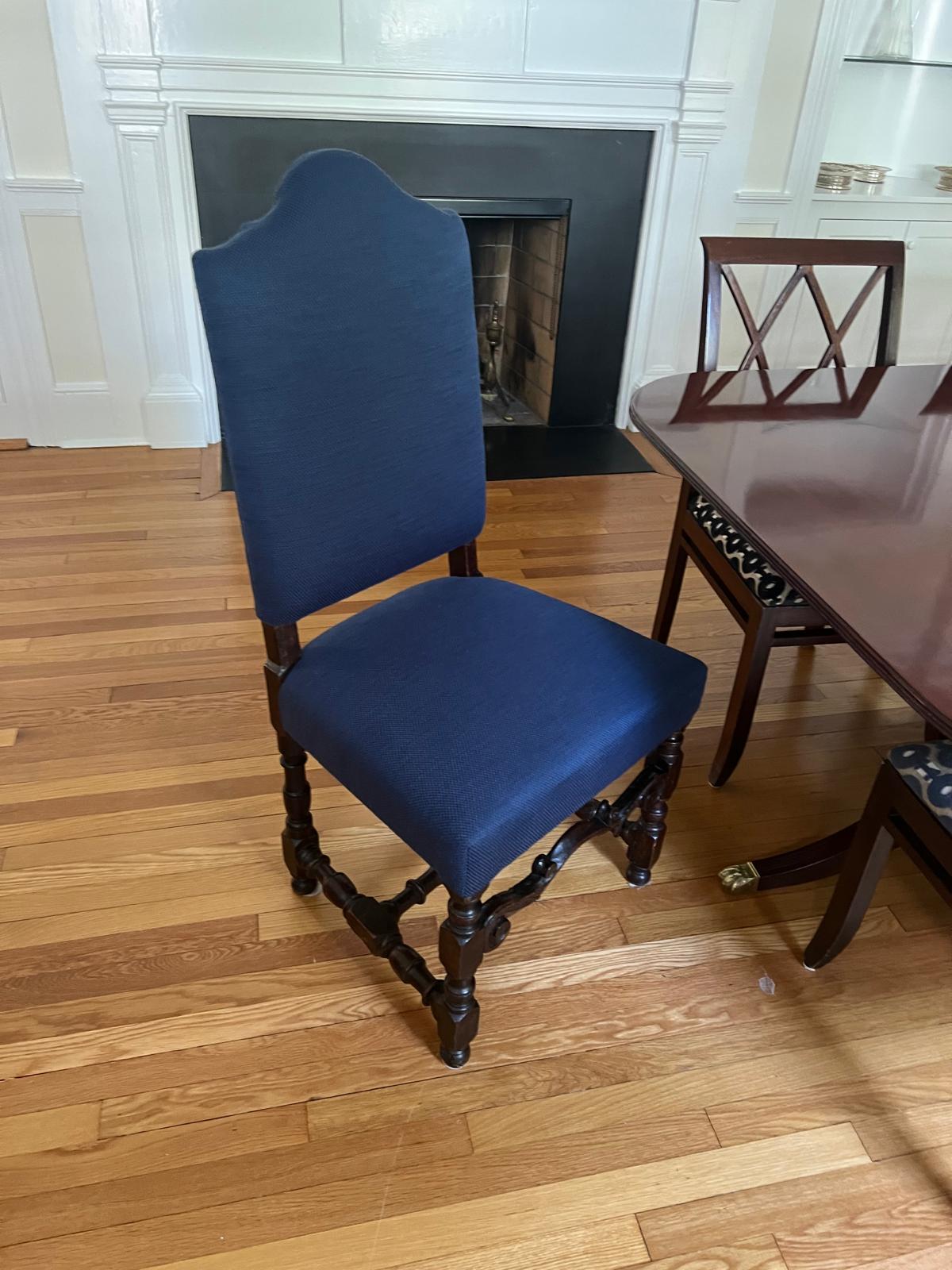 Blue dining chair by fireplace