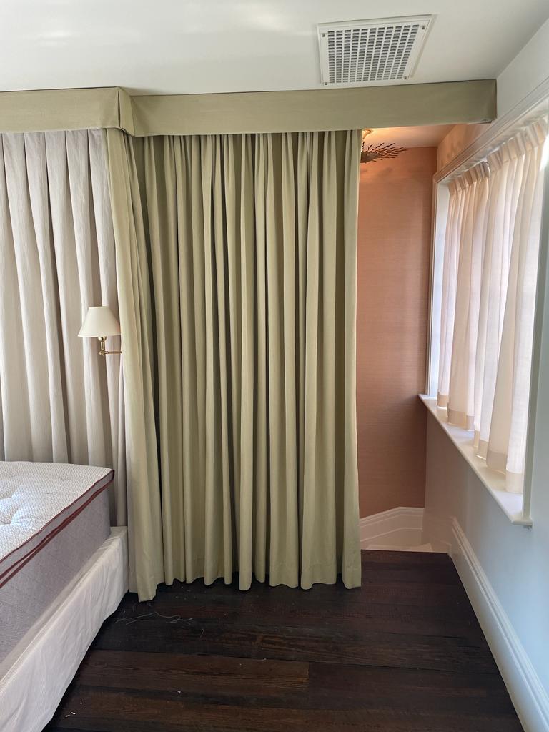 Drapes with cornice in bedroom