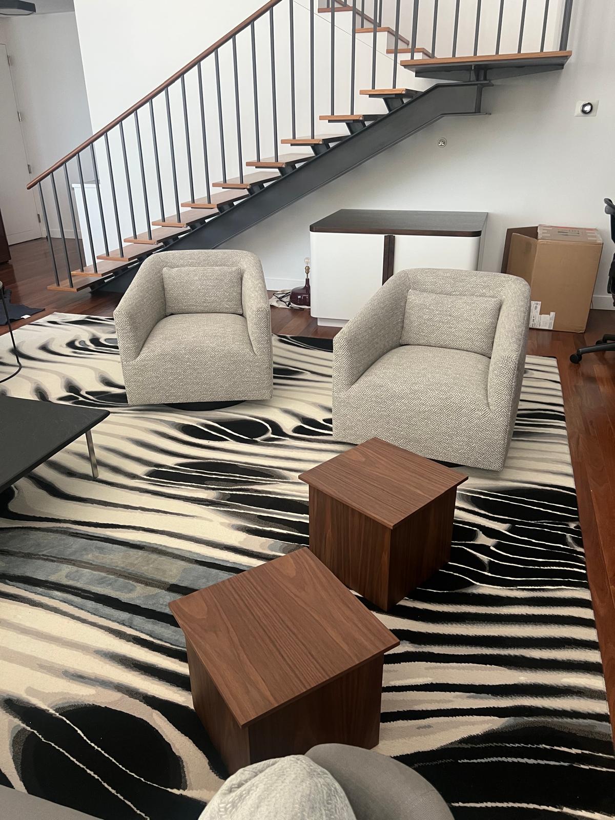 Two modern chairs on zebra rug