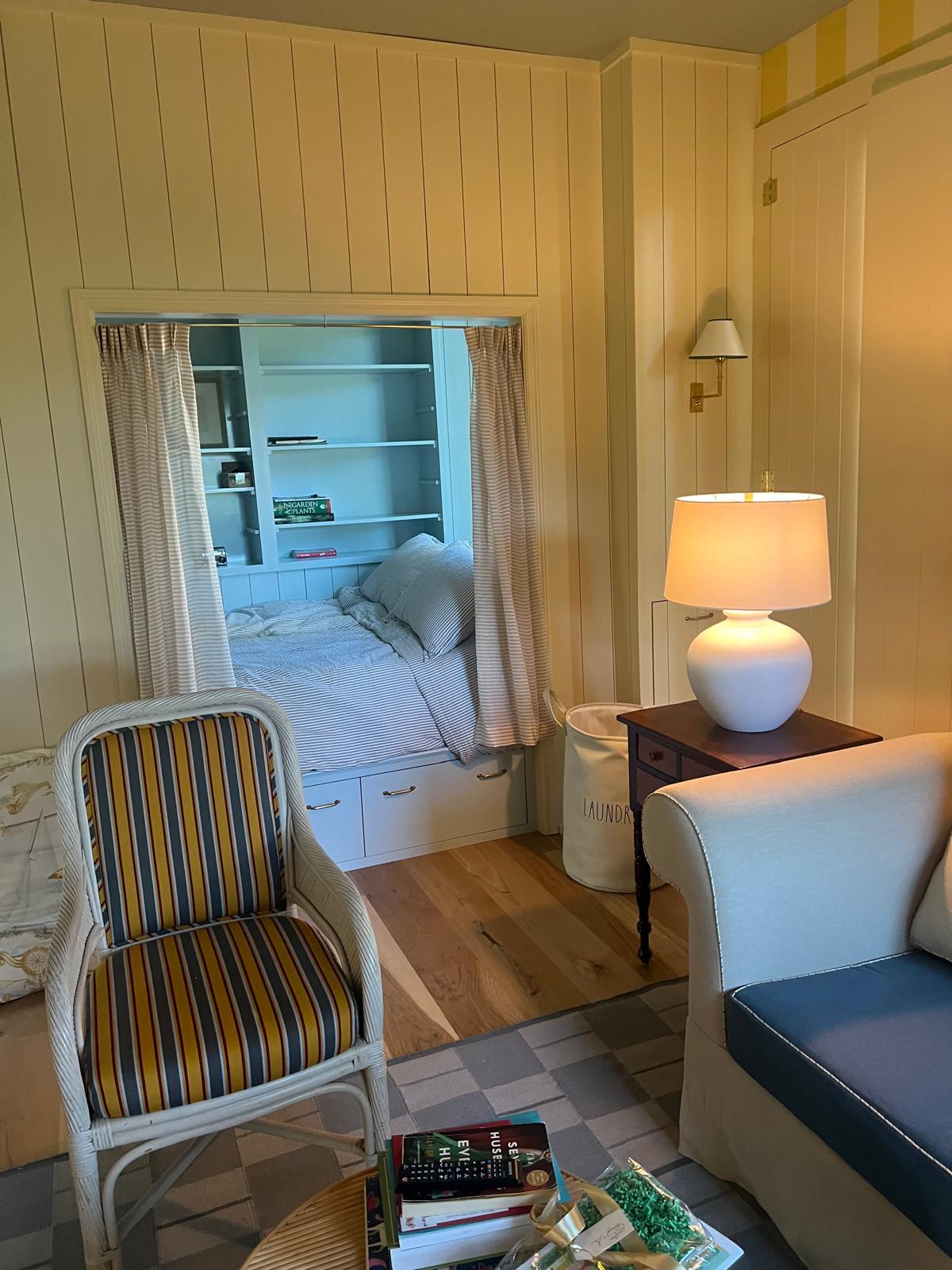 Striped rattan chair in cottage room