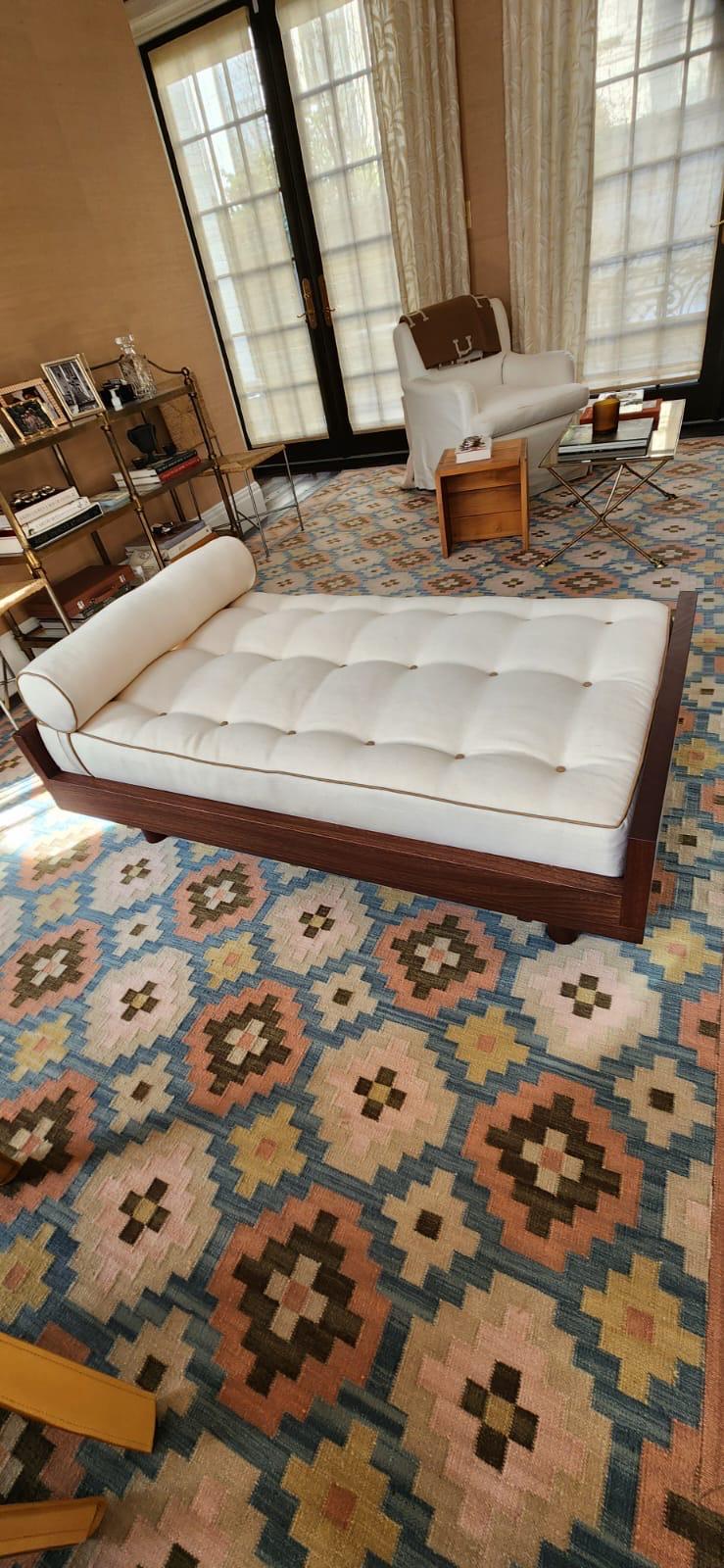 White tufted daybed in living room