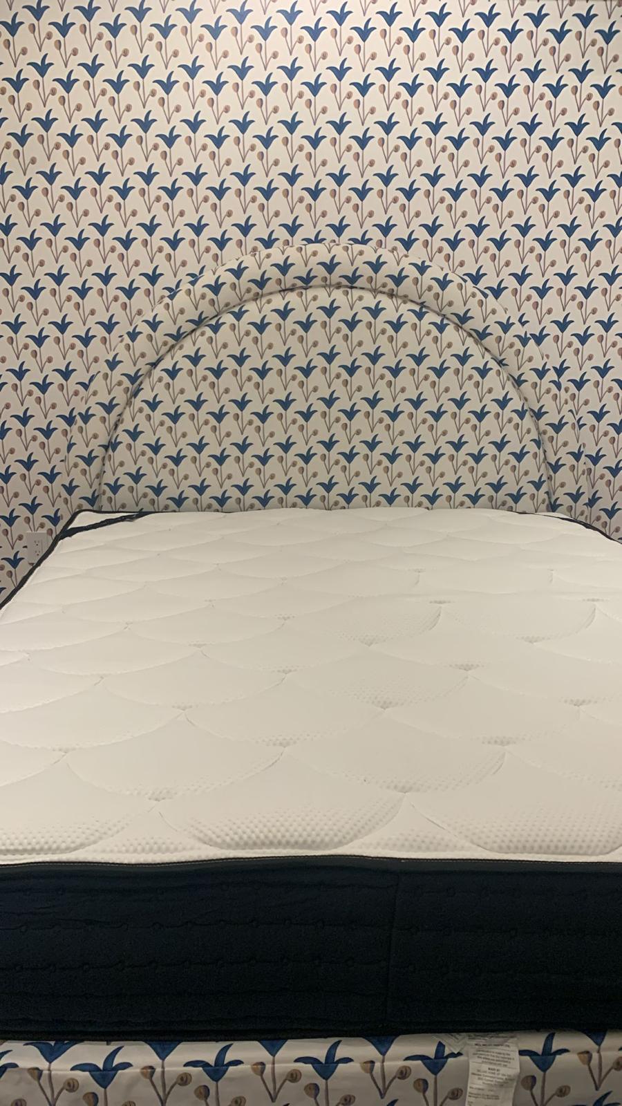 Floral arched upholstered headboard in workshop