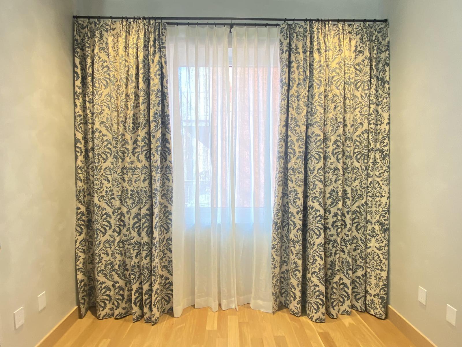 Blue and cream damask floor-length drapes