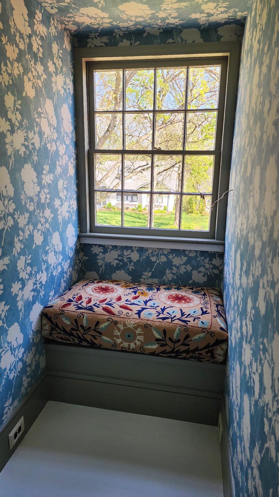 Custom floral window seat cushion in reading nook