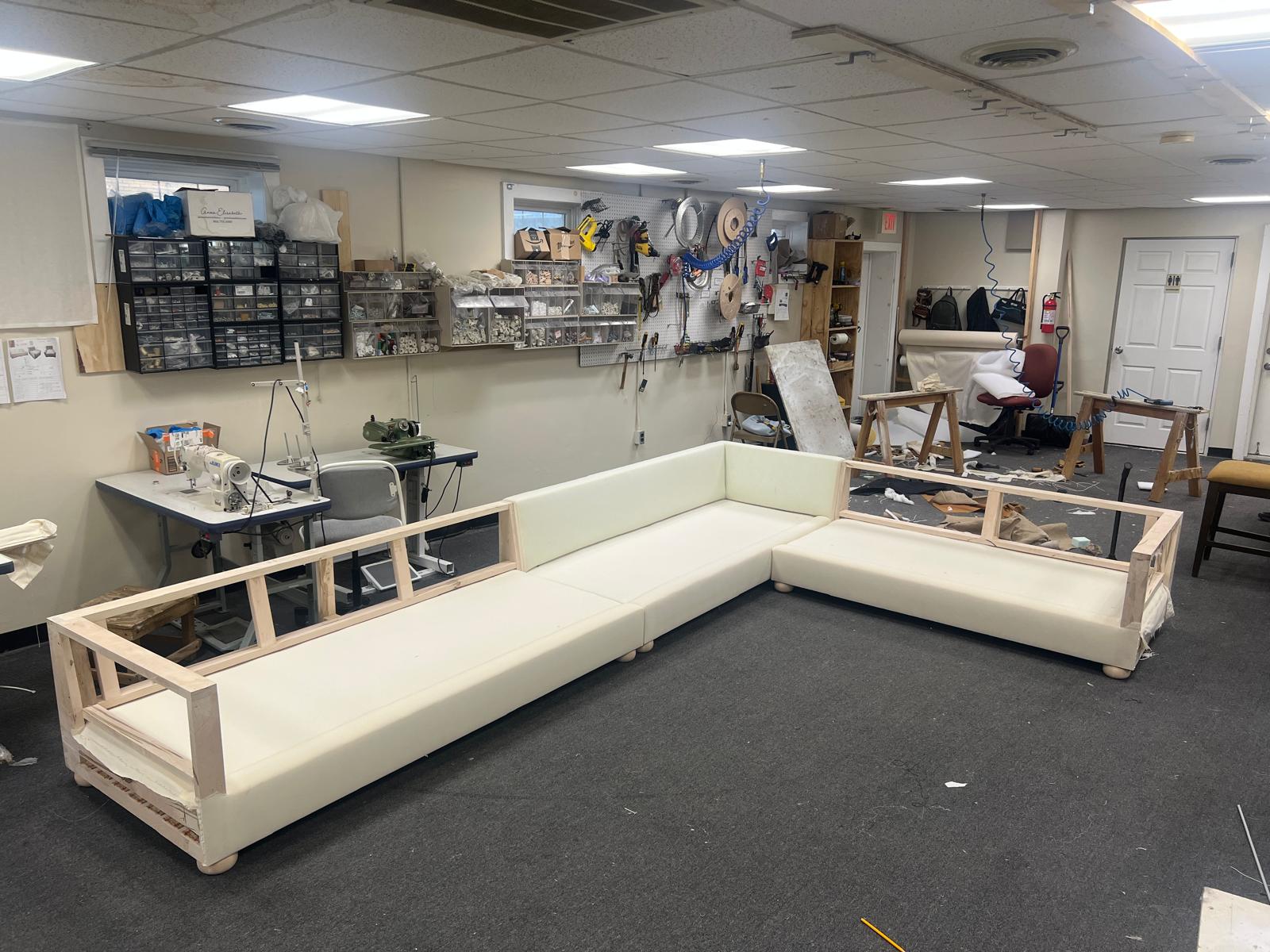 Large sectional sofa frame being built in workshop