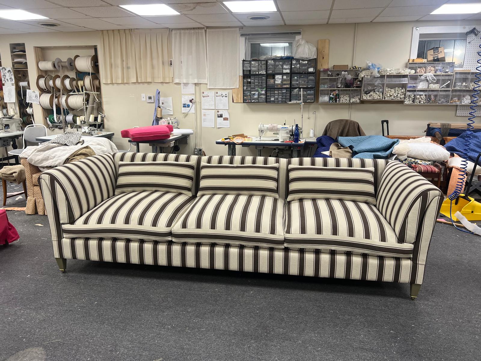 Large striped grand sofa in workshop