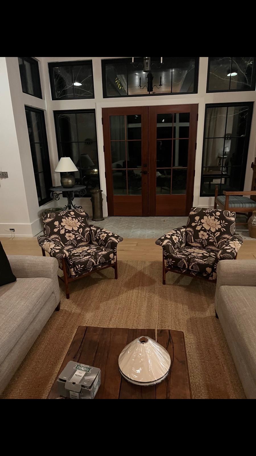 Pair of dark floral arm chairs in living room